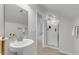 Bathroom with pedestal sink and tiled shower at 81 Crossandra Ave, Summerville, SC 29483