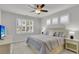 Serene bedroom with natural light, plantation shutters, and ceiling fan at 81 Crossandra Ave, Summerville, SC 29483