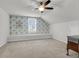 Bright bedroom with decorative wallpaper and ceiling fan and window bench at 81 Crossandra Ave, Summerville, SC 29483