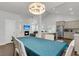 A dining area with hardwood floors that opens to the living area and kitchen at 81 Crossandra Ave, Summerville, SC 29483