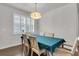 Formal dining room with hardwood floors and a modern chandelier at 81 Crossandra Ave, Summerville, SC 29483