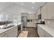 Bright, modern kitchen with stainless steel appliances and light grey cabinetry at 81 Crossandra Ave, Summerville, SC 29483