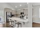 A kitchen island with stainless steel appliances and granite countertops at 81 Crossandra Ave, Summerville, SC 29483