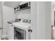 Spacious laundry room includes side-by-side washer and dryer, and a storage shelf at 81 Crossandra Ave, Summerville, SC 29483