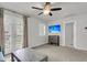 Living room with access to the outside patio, flatscreen television, curtains and white shutters at 81 Crossandra Ave, Summerville, SC 29483