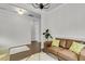 Cozy living room with a comfortable leather sofa, neutral decor, and hardwood floors at 81 Crossandra Ave, Summerville, SC 29483