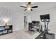 Bright office featuring a ceiling fan, modern wallpaper, and space for a workstation and workout equipment at 81 Crossandra Ave, Summerville, SC 29483