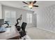 Inviting office featuring a ceiling fan, shutters, and space for a workstation and workout equipment at 81 Crossandra Ave, Summerville, SC 29483