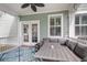 Comfortable covered patio featuring stylish outdoor furniture and ceiling fan at 81 Crossandra Ave, Summerville, SC 29483