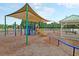 Community playground with swings, slides, climbing equipment, and picnic area at 81 Crossandra Ave, Summerville, SC 29483