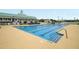 Community pool with lanes for swimming and a clubhouse in the background at 81 Crossandra Ave, Summerville, SC 29483