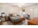 Comfortable bedroom with natural light, a cozy bed, and a functional workspace at 8268 Timberidge Ct, North Charleston, SC 29420