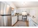 Modern kitchen with stainless steel appliances and granite countertops and plenty of cabinet space at 8268 Timberidge Ct, North Charleston, SC 29420