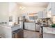 Well-lit kitchen featuring stainless steel appliances, granite countertops, and ample cabinet space at 8268 Timberidge Ct, North Charleston, SC 29420