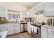 Close up of kitchen featuring stainless steel appliances, granite countertops, and a bright window at 8268 Timberidge Ct, North Charleston, SC 29420