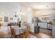 Open concept kitchen with stainless steel appliances, granite countertops, and adjacent living space at 8268 Timberidge Ct, North Charleston, SC 29420