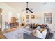 Bright living room features vaulted ceilings, a ceiling fan and hardwood floors at 8268 Timberidge Ct, North Charleston, SC 29420