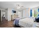 Comfortable primary bedroom with ensuite bath features ample closet space and natural light at 856 Club Cottage Rd, Edisto Beach, SC 29438