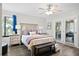 Comfortable primary bedroom with ensuite bath features ample closet space and natural light at 856 Club Cottage Rd, Edisto Beach, SC 29438