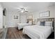 Bright bedroom featuring wood floors, and 2 twin beds at 856 Club Cottage Rd, Edisto Beach, SC 29438