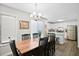 A dining room featuring seating for six with a view of the kitchen at 856 Club Cottage Rd, Edisto Beach, SC 29438