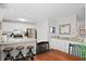 A well-lit kitchen with white cabinetry, stainless steel appliances, and granite countertops at 856 Club Cottage Rd, Edisto Beach, SC 29438