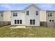 Exterior view of the back of the home, showcasing the yard and windows at 982 Augustine Ct, Summerville, SC 29483