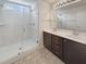 Bathroom featuring double sinks, a shower with glass door, and modern fixtures at 982 Augustine Ct, Summerville, SC 29483