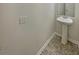 Powder room with pedestal sink and neutral flooring at 982 Augustine Ct, Summerville, SC 29483