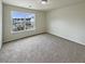 Bedroom with plush carpet and a large window providing ample natural light at 982 Augustine Ct, Summerville, SC 29483