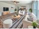Comfortable living room featuring a fireplace, modern furniture, hardwood floors, and open layout to the kitchen at 982 Augustine Ct, Summerville, SC 29483