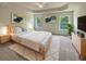 Main bedroom featuring a tray ceiling, ceiling fan, and natural light at 982 Augustine Ct, Summerville, SC 29483