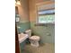 Vintage bathroom features classic tile, sink, toilet, and window with natural light at 10 Cranford Rd, Goose Creek, SC 29445
