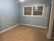 Bedroom featuring light blue walls, laminate flooring and large window for ample light at 10 Cranford Rd, Goose Creek, SC 29445