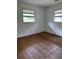 View of bedroom with hardwood floors and two windows at 10 Cranford Rd, Goose Creek, SC 29445