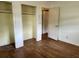 View of a bedroom with hardwood floors, a closet and open doorway at 10 Cranford Rd, Goose Creek, SC 29445