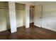 View of a bedroom with hardwood floors, a closet and open doorway at 10 Cranford Rd, Goose Creek, SC 29445