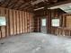 Spacious garage with concrete floors, wood-framed walls, and natural light from windows at 10 Cranford Rd, Goose Creek, SC 29445