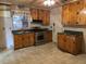 Kitchen featuring wood cabinets, stainless steel appliances, and a window at 10 Cranford Rd, Goose Creek, SC 29445