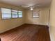 Living room features hardwood floors, a ceiling fan, and natural light from multiple windows at 10 Cranford Rd, Goose Creek, SC 29445