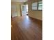 Living room with hardwood floors, door to outside, and natural light from a window at 10 Cranford Rd, Goose Creek, SC 29445