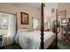 Charming bedroom suite featuring a four-poster bed and ensuite bathroom at 102 Amberside Dr, Goose Creek, SC 29445