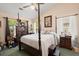 Elegant main bedroom with a four-poster bed and natural light from large windows at 102 Amberside Dr, Goose Creek, SC 29445
