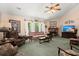 Cozy living room with a decorative ceiling fan, and a brick fireplace at 102 Amberside Dr, Goose Creek, SC 29445