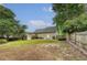 The backyard features a lawn with an in-ground sprinkler and a wooded fence at 102 Bristol Ln, Goose Creek, SC 29445