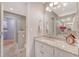 Bright bathroom featuring granite countertops, white cabinets, and a glass-enclosed shower at 102 Bristol Ln, Goose Creek, SC 29445