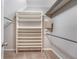 Spacious walk-in closet with built-in shelving and rods for ample storage space at 102 Bristol Ln, Goose Creek, SC 29445