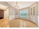 Bright dining area features hardwood floors, chair rail, and built-in cabinets at 102 Bristol Ln, Goose Creek, SC 29445