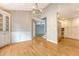 Dining area with hardwood floors adjacent to kitchen boasts recessed lighting at 102 Bristol Ln, Goose Creek, SC 29445