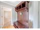 A stylish hall tree in the foyer with storage and decorative touches, leading to a carpeted living space at 102 Bristol Ln, Goose Creek, SC 29445